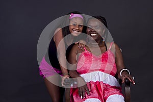 Portrait of an African American grandmother with her  granddaughter in an intimate and happy momen