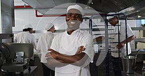 Portrait of african american male chef with arms crossed looking at camera