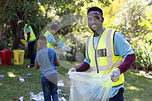 Portrait of an African American man collecting garbage