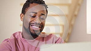 Portrait of african american man flirting chatting on online date website.