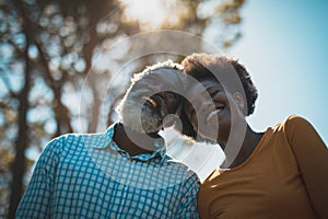 Portrait of african american senior couple looking ahead and smiling