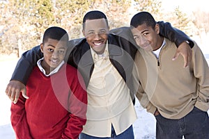 Portrait of African American teenage brothers smiling.