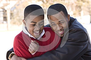 Portrait of African American teenage brothers smiling. photo