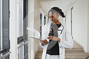 Portrait of African American woman doctor smiling in hospital