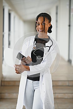 Portrait of African American woman doctor smiling in hospital