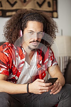 Portrait of an african american young man listening music