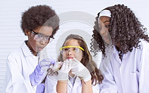 Portrait of african black and caucasian boy and girls studying science