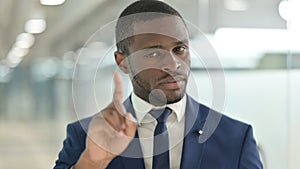 Portrait of African Businessman saying No with Finger Sign photo
