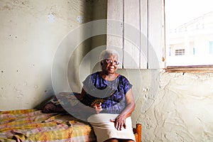 Portrait of African elderly woman sitting