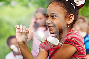 Portrait of African girl and marshmallow stick