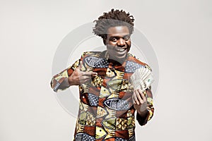 Portrait of african kongo businessman, holding many cash and smile