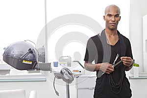 Portrait of African male hairdresser photo