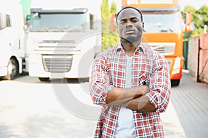 portrait African male happy Smiling confident positive near lorry. Young Man plaid shirt owner Truck Driver In Business