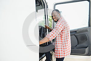 portrait African male happy Smiling confident positive near lorry. Young Man plaid shirt owner Truck Driver In Business