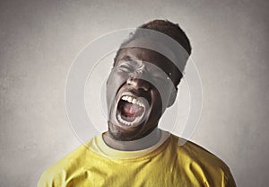 Portrait of an african man screaming