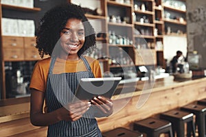 Portrait of an african young female cafe owner photo