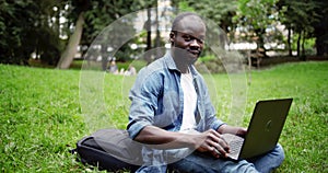 Portrait of Afro-american male with laptop