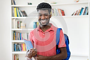 Portrait of afro american male student with backpack