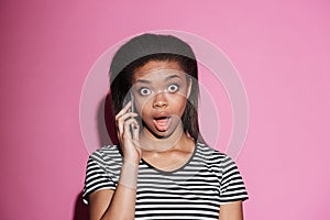 Portrait of a afro american woman gossiping on mobile phone