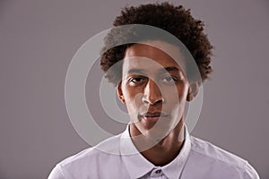 Portrait, afro and business with young black man in studio on gray background for professional career. Company, face or