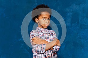 Portrait of afro kid boy hurt or upset offended sensitive.