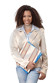 Portrait of afro woman with folders smiling