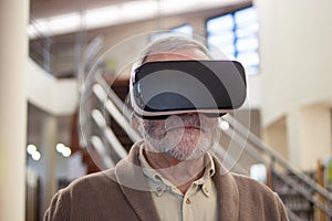 Portrait of aged man in virtual glasses