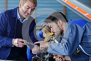 Portrait aircraft mechanics at work