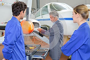 portrait airplane engineers working