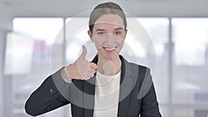 Portrait of Ambitious Young Businesswoman doing Thumbs Up