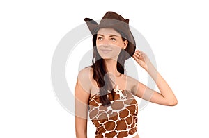 Portrait of a american cowgirl with hat looking up.