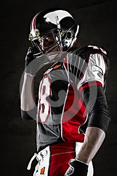 Portrait of american football player looking aside photo