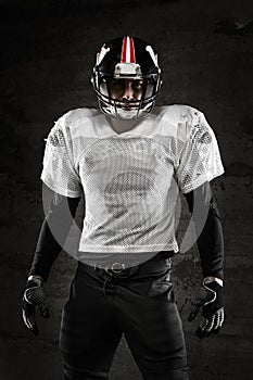Portrait of american football player looking at camera