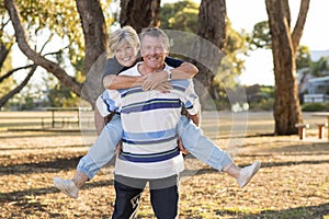 Portrait of American senior beautiful and happy mature couple around 70 years old showing love and affection smiling together in t