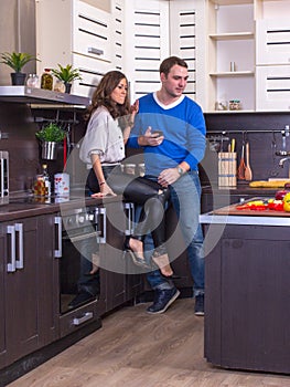 Portrait Of Amorous Couple With apple In The Kitchen