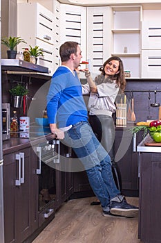 Portrait Of Amorous Couple With food In The Kitchen