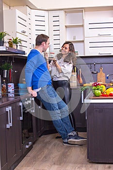 Portrait Of Amorous Couple With food In The Kitchen