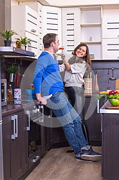 Portrait Of Amorous Couple With food In The Kitchen