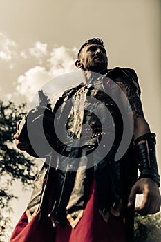 Portrait of ancient Spartan warrior in battle dress with helmet