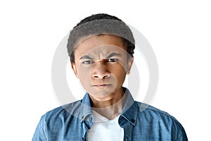 portrait of angry african american teen boy looking at camera