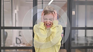 Portrait of Angry Blonde Young Woman Screaming in Anger