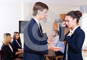 Portrait of angry boss and upset employee