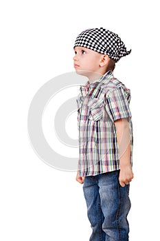 Angry capricious preschool kid on white photo