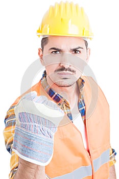 Portrait of angry constructor or engineer showing his fist