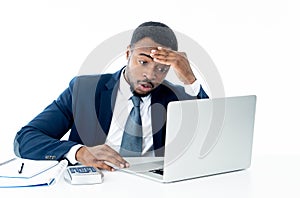 Portrait of angry and frustrated businessman shouting at laptop desperate, overworked and stressed