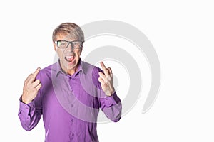 Portrait of a angry man with glasses staring at camera, shows finger and shouting over white background