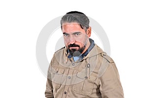 Portrait of angry man looking at camera on white background.
