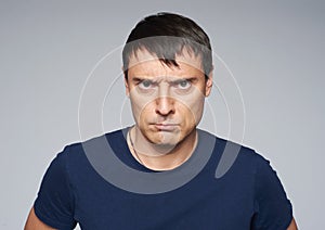 Portrait of angry man looking furious