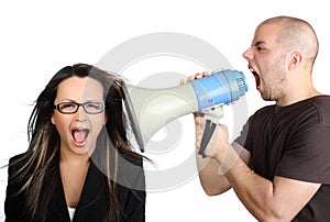 Portrait of angry man shouting at megaphone