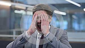 Portrait of Angry Middle Aged Businessman Screaming, Shouting